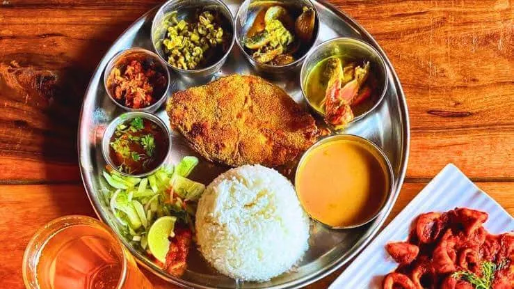 A traditional Goan fish thali with fresh seafood and sol kadhi