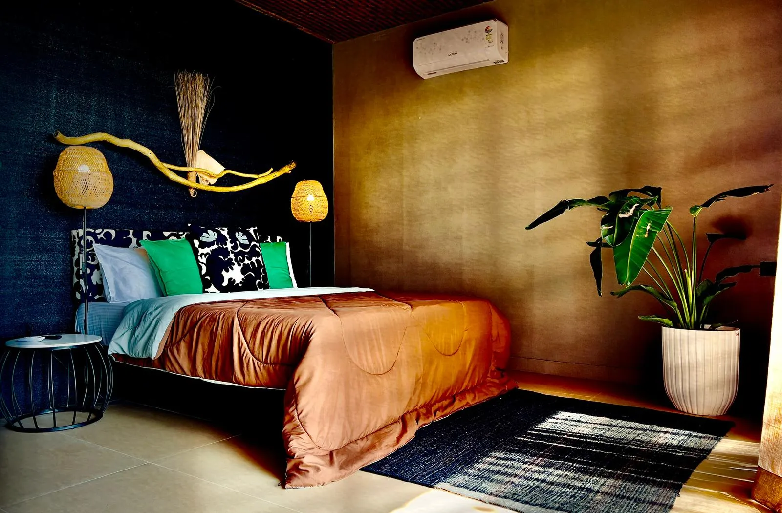 Interior of a spacious air-conditioned beachfront bungalow with a king-size bed at Turtle Hill